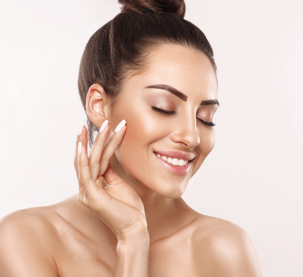 Portrait of woman with beauty face and perfect skin on gray background. Skin care. Cosmetology, beauty and spa | Skin Parlour